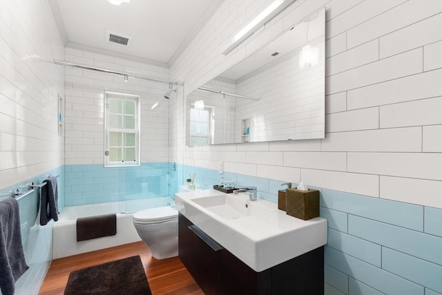 20 Birch Hill Rd, Newton, MA 02465 - full bathroom featuring tile walls, vanity, wood finished floors, shower / bathtub combination, and crown molding