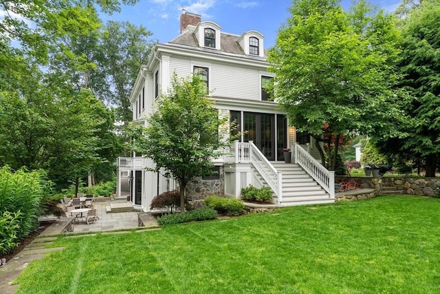 20 Birch Hill Rd, Newton, MA 02465 - back of property with stairway, a patio, a sunroom, and a yard