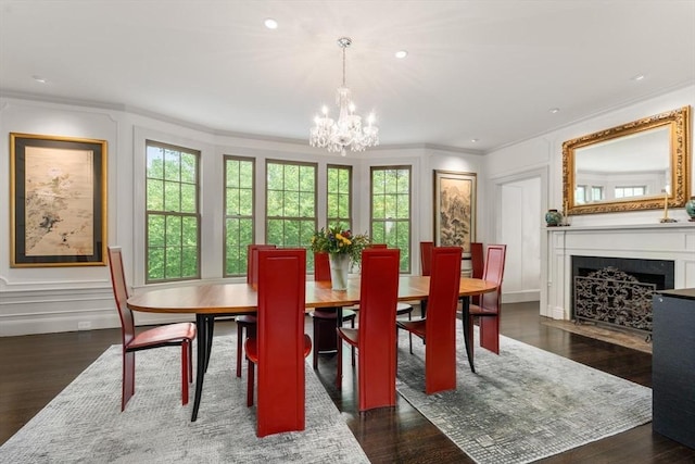 20 Birch Hill Rd, Newton, MA 02465 - dining space with crown molding, a decorative wall, plenty of natural light, a chandelier, and dark wood-type flooring