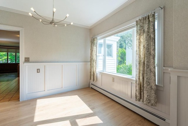 23 Shawmut Ave, Lowell, MA 01851 - unfurnished dining area with baseboard heating, ornamental molding, a wainscoted wall, a chandelier, and a decorative wall