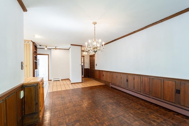 23 Shawmut Ave, Lowell, MA 01851 - unfurnished room with a baseboard radiator, baseboard heating, a chandelier, wainscoting, and wood walls