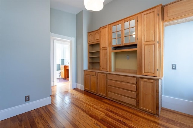 23 Shawmut Ave, Lowell, MA 01851 - unfurnished dining area featuring dark wood-style flooring and baseboards