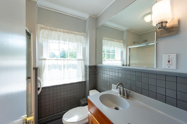 23 Shawmut Ave, Lowell, MA 01851 - bathroom with tile walls, ornamental molding, toilet, vanity, and a shower with door