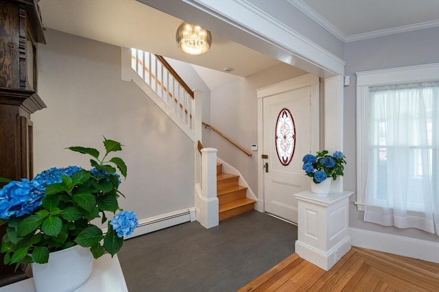 23 Shawmut Ave, Lowell, MA 01851 - entrance foyer featuring plenty of natural light, stairway, a baseboard radiator, and crown molding
