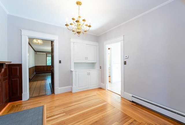 23 Shawmut Ave, Lowell, MA 01851 - unfurnished dining area with a chandelier, a baseboard radiator, light wood-style flooring, ornamental molding, and baseboards