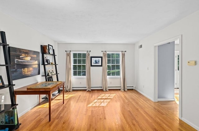 7 Paddock Way, Marshfield, MA 02050 - entryway with light wood-style flooring, baseboards, and a baseboard radiator