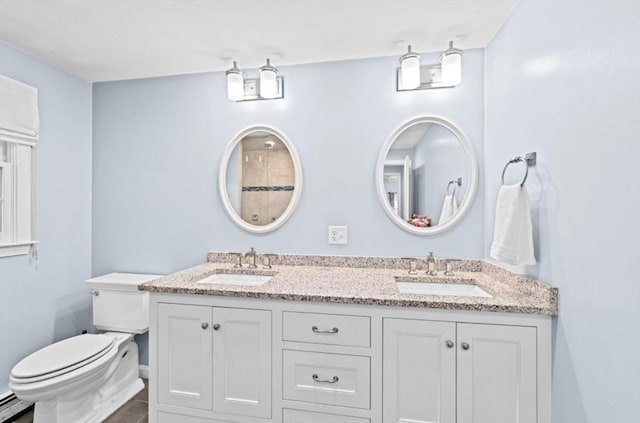 7 Paddock Way, Marshfield, MA 02050 - bathroom featuring double vanity, toilet, and a baseboard radiator
