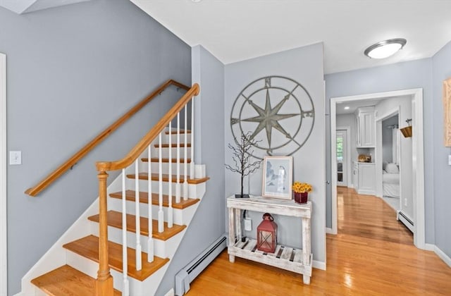 7 Paddock Way, Marshfield, MA 02050 - stairs with baseboard heating, wood finished floors, and baseboards
