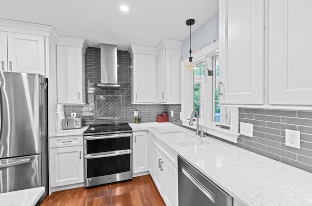 7 Paddock Way, Marshfield, MA 02050 - kitchen featuring stainless steel appliances, a sink, wall chimney range hood, white cabinetry, and tasteful backsplash