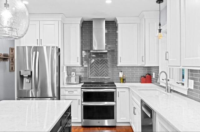 7 Paddock Way, Marshfield, MA 02050 - kitchen featuring stainless steel appliances, wall chimney exhaust hood, a sink, white cabinets, and recessed lighting