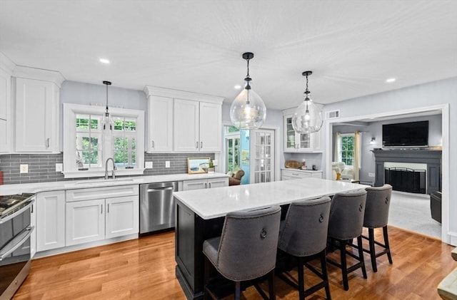 7 Paddock Way, Marshfield, MA 02050 - kitchen with appliances with stainless steel finishes, a sink, white cabinetry, tasteful backsplash, and recessed lighting
