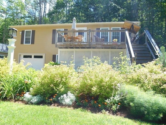 951 Dana Rd, Barre, MA 01005 - view of front facade featuring an attached garage, stairway, and a wooden deck