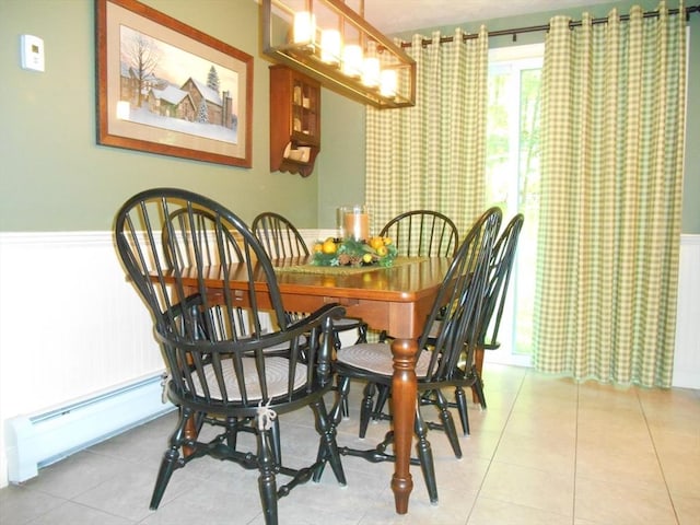 951 Dana Rd, Barre, MA 01005 - dining area featuring a baseboard radiator, wainscoting, and tile patterned flooring