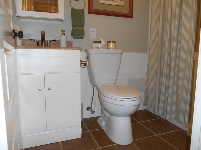 951 Dana Rd, Barre, MA 01005 - bathroom with a wainscoted wall, toilet, vanity, tile patterned flooring, and a shower with curtain