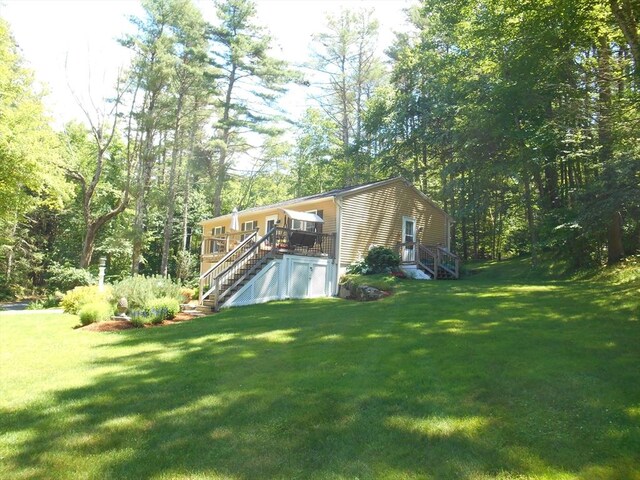 951 Dana Rd, Barre, MA 01005 - view of green lawn with stairs and a deck