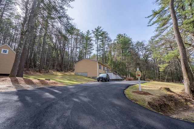 951 Dana Rd, Barre, MA 01005 - view of road with traffic signs and a wooded view