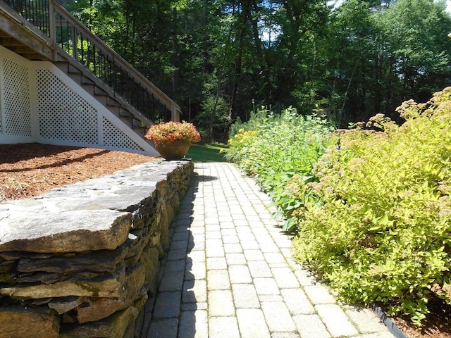 951 Dana Rd, Barre, MA 01005 - exterior view of stairs and a heavily wooded area