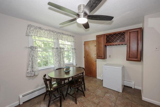 3 Myles Standish Dr Unit 8, Haverhill, MA 01835 - dining area featuring a baseboard radiator, ceiling fan, and baseboards