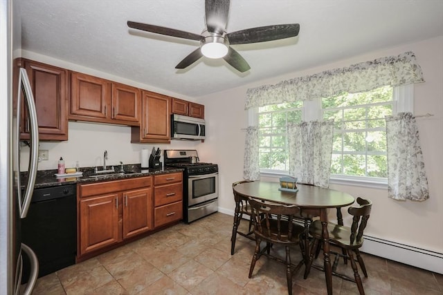 3 Myles Standish Dr Unit 8, Haverhill, MA 01835 - kitchen with appliances with stainless steel finishes, a sink, baseboard heating, a ceiling fan, and brown cabinetry