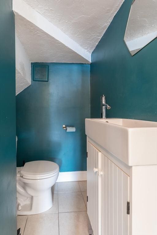 27 Round Hill St, Boston, MA 02130 - half bathroom with tile patterned floors, vanity, and a textured ceiling