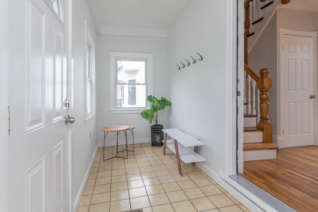 27 Round Hill St, Boston, MA 02130 - mudroom featuring ornamental molding and light tile patterned flooring
