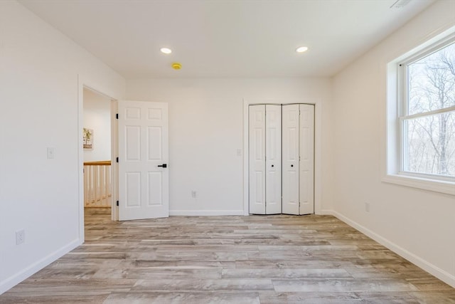 LOT4 Granite St, Worcester, MA 01604 - unfurnished bedroom featuring multiple windows, light wood-type flooring, recessed lighting, and a closet