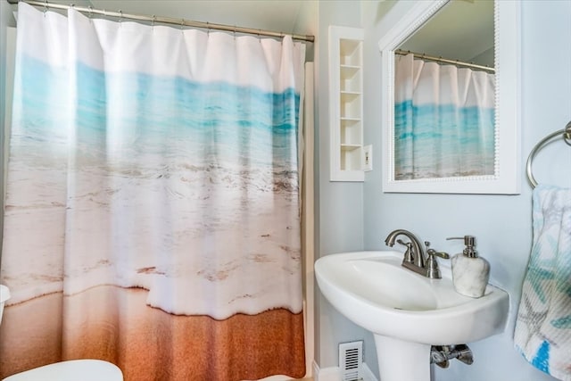 bathroom with toilet and sink