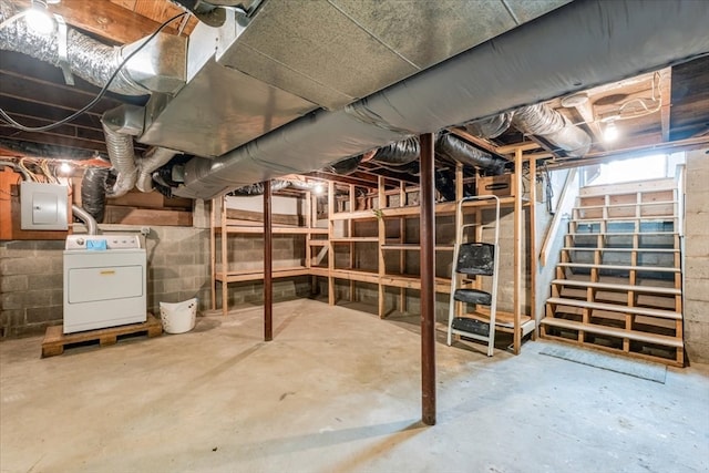 basement with washer / clothes dryer and electric panel