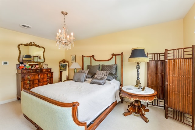 bedroom with a chandelier and light colored carpet