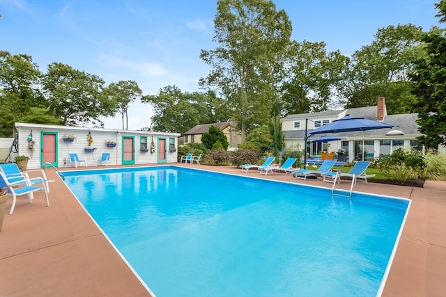 view of swimming pool with a patio area