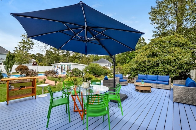 wooden deck featuring outdoor lounge area