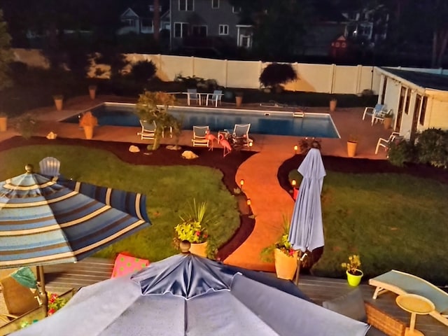 view of pool with a lawn and a patio area