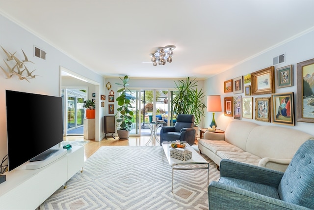 living room featuring crown molding and light hardwood / wood-style floors