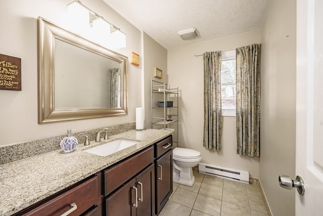 bathroom featuring vanity, a textured ceiling, tile patterned flooring, toilet, and baseboard heating