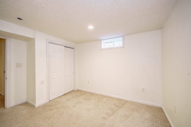 basement with light colored carpet