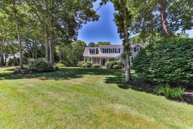 view of front of house featuring a front yard and a porch