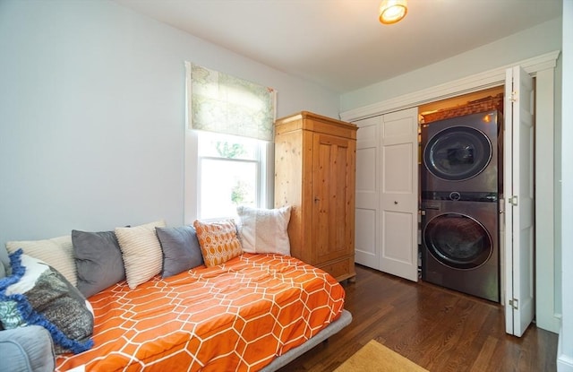 79 Henderson St, Needham, MA 02492 - bedroom with stacked washing machine and dryer, dark wood-style floors, and a closet