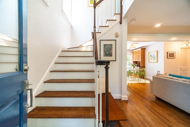 79 Henderson St, Needham, MA 02492 - stairway featuring wood finished floors and baseboards