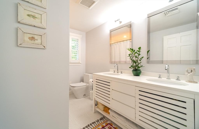 79 Henderson St, Needham, MA 02492 - bathroom featuring double vanity and tile patterned flooring