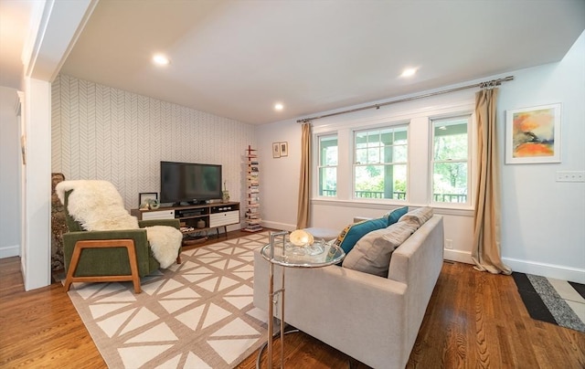 79 Henderson St, Needham, MA 02492 - living area featuring wallpapered walls, an accent wall, wood finished floors, and recessed lighting