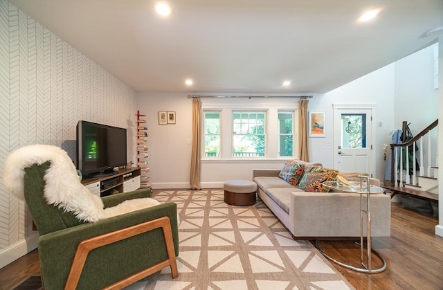 79 Henderson St, Needham, MA 02492 - living room featuring an accent wall, wallpapered walls, recessed lighting, stairway, and light wood-style floors