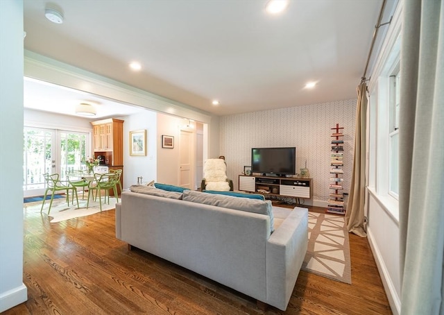 79 Henderson St, Needham, MA 02492 - living room featuring wallpapered walls, wood finished floors, recessed lighting, and an accent wall