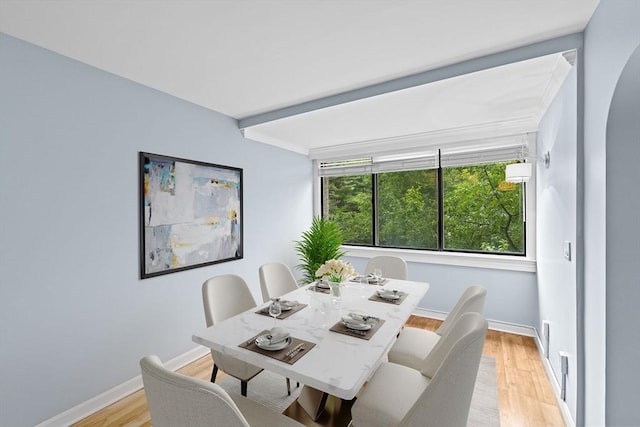 250 Hammond Pond Pkwy Unit 409S, Newton, MA 02467 - dining space featuring light wood-style floors and arched walkways