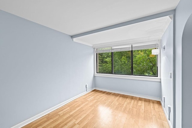 250 Hammond Pond Pkwy Unit 409S, Newton, MA 02467 - empty room featuring wood finished floors and arched walkways