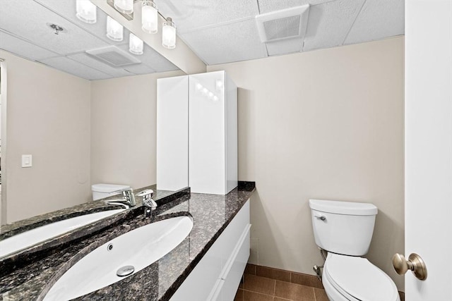 250 Hammond Pond Pkwy Unit 409S, Newton, MA 02467 - bathroom featuring vanity, tile patterned floors, and a drop ceiling