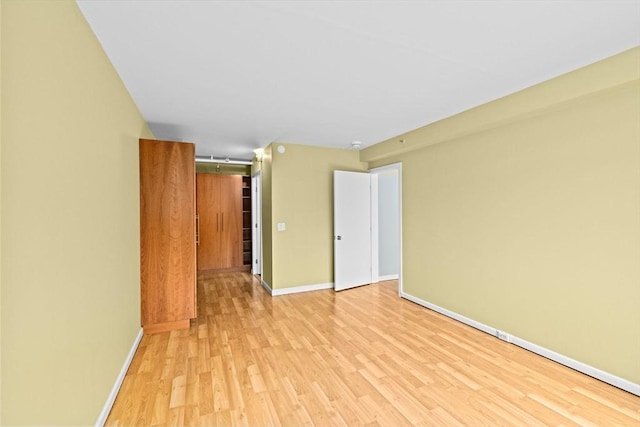 250 Hammond Pond Pkwy Unit 409S, Newton, MA 02467 - spare room with light wood-style floors and baseboards
