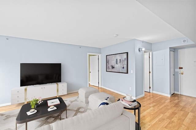 250 Hammond Pond Pkwy Unit 409S, Newton, MA 02467 - living area featuring light wood-type flooring and baseboards
