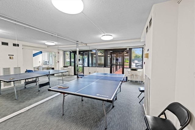 250 Hammond Pond Pkwy Unit 409S, Newton, MA 02467 - game room featuring a textured ceiling, plenty of natural light, and carpet
