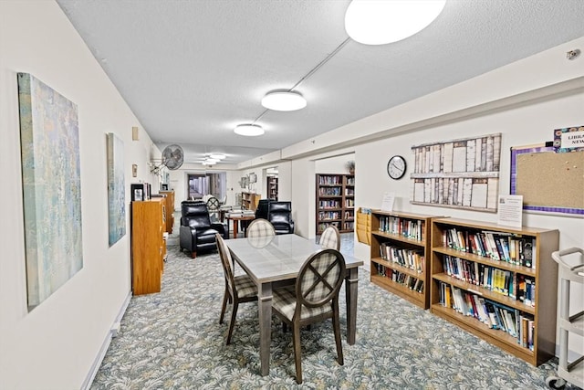 250 Hammond Pond Pkwy Unit 409S, Newton, MA 02467 - carpeted dining room with a textured ceiling and ceiling fan