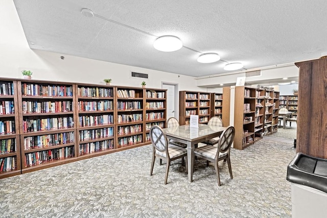 250 Hammond Pond Pkwy Unit 409S, Newton, MA 02467 - dining room with carpet floors and a textured ceiling